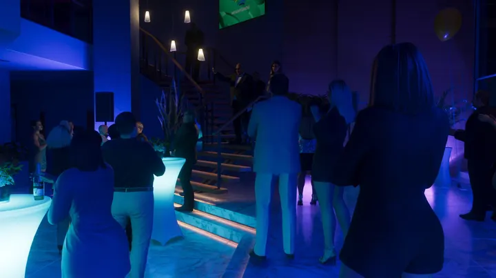Blue lit party on the stairs