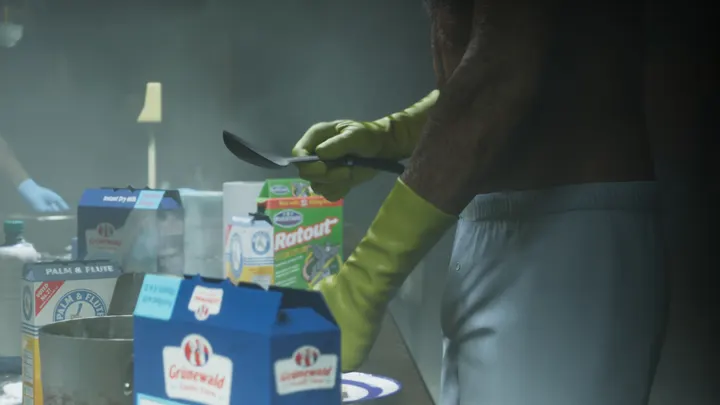 Stirring the pot in yellow gloves
