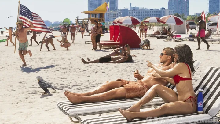 Sunbathers and a flag on the sand