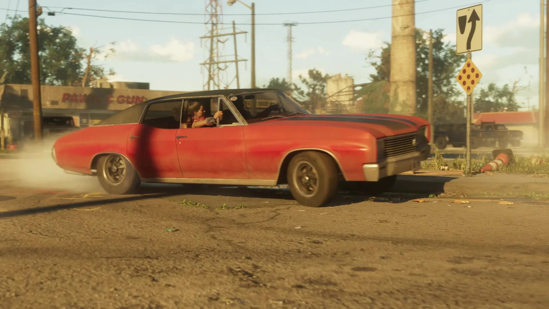 A red muscle car with a black roof speeds past a Pawn and Gun shop in a rundown GTA 6 town.