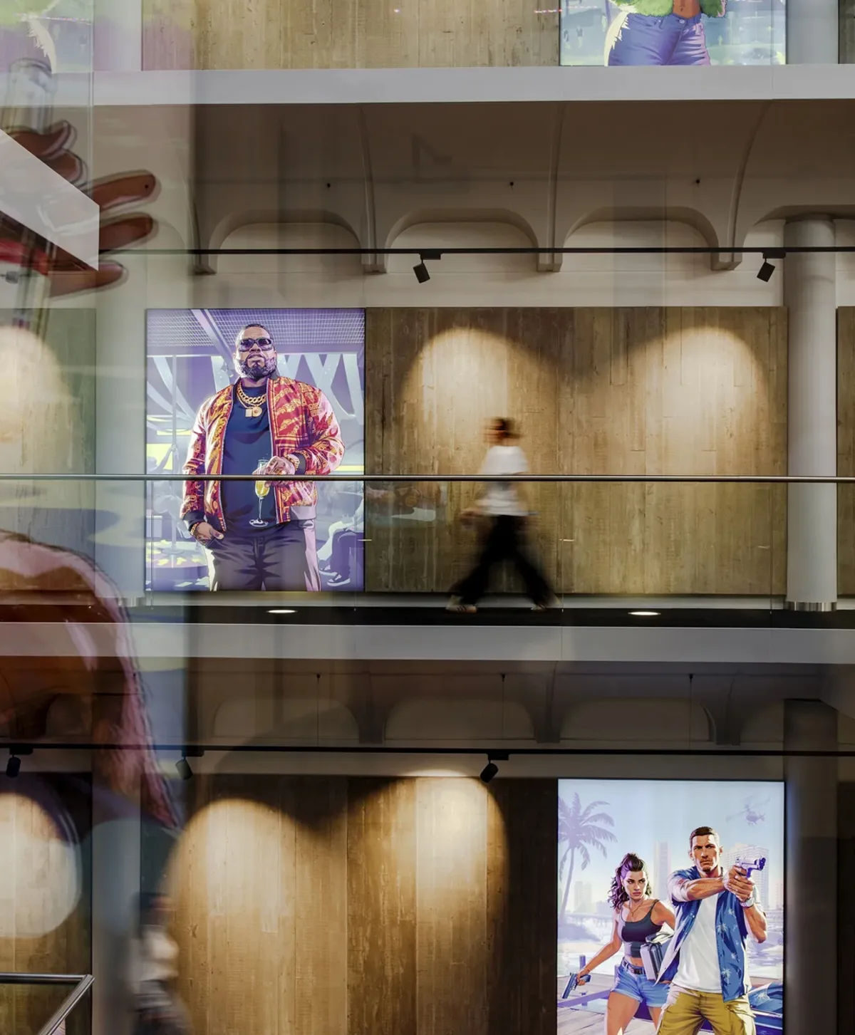 GTA 6 artwork panels lining an atrium walkway inside the Rockstar North studio