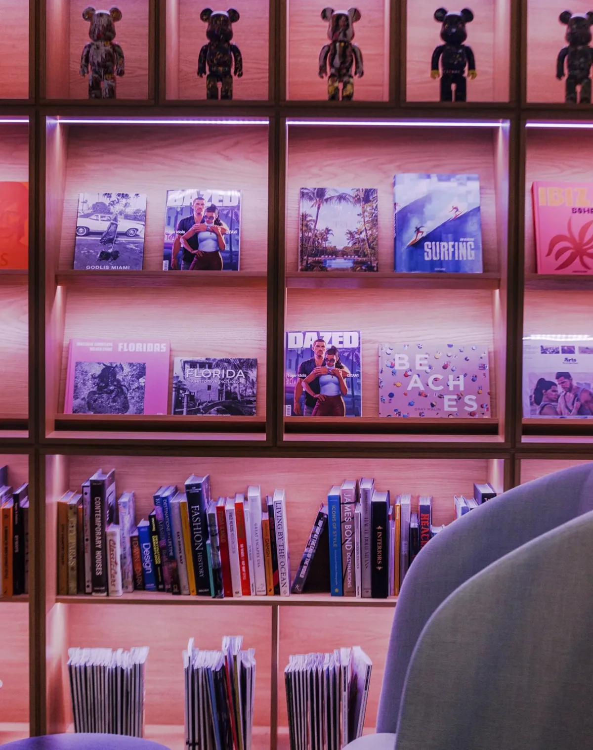 Studio shelves holding Florida photography books and collectible figures at Rockstar North