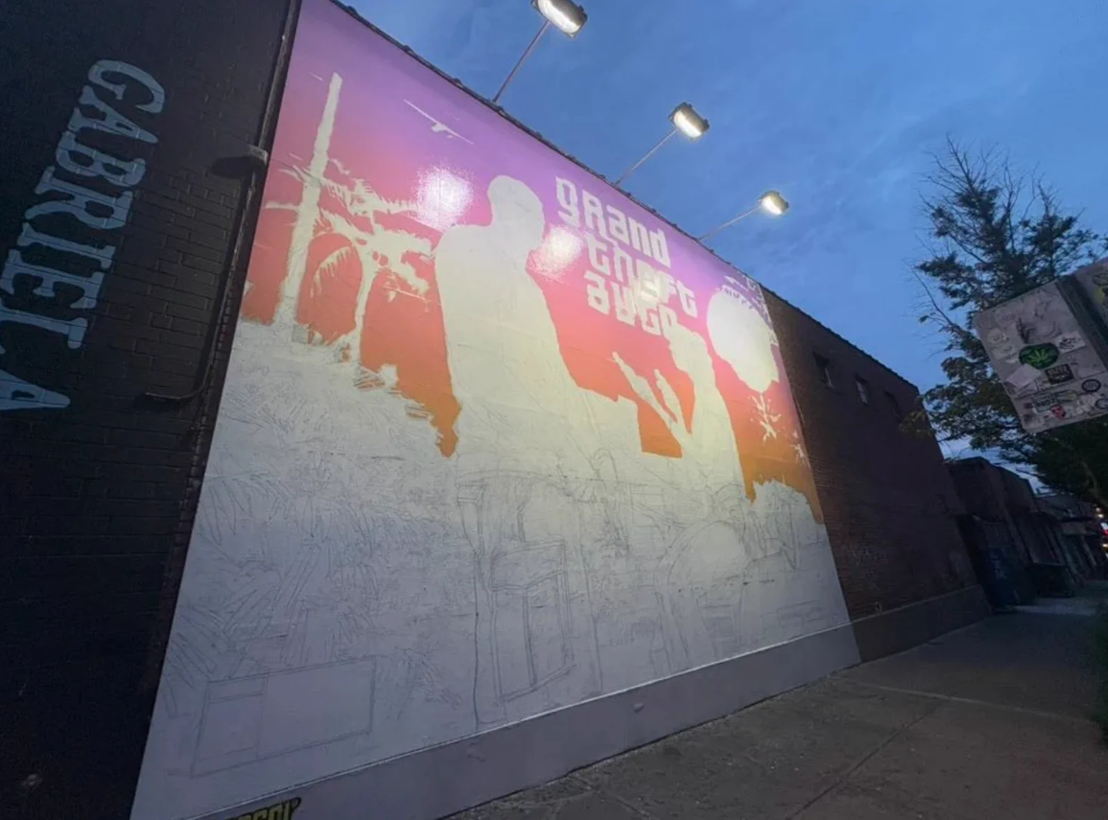 The GTA 6 mural in Williamsburg mid-painting with colour at the top and pencil linework below