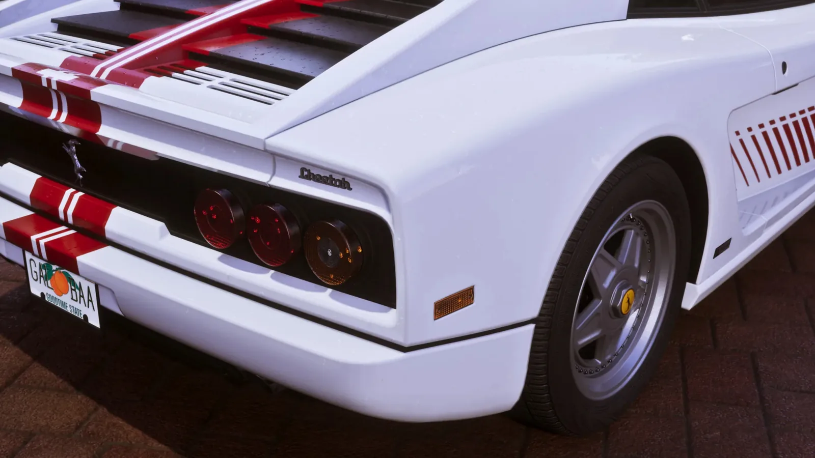 Rear view of a white Grotti Cheetah in GTA 6 showing modeled panel gaps around the engine cover and tail lights