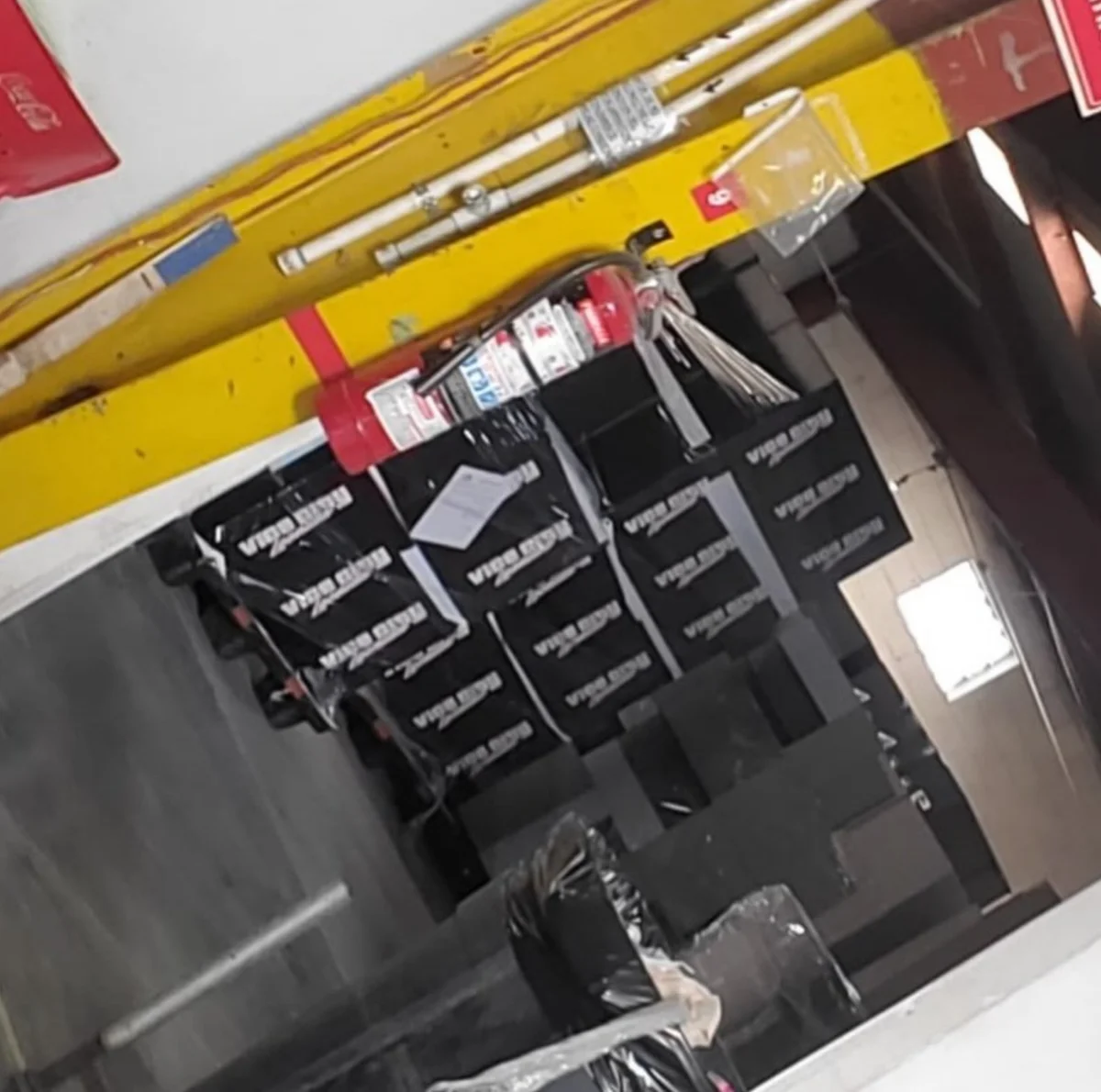 Leaked photo of black GTA 6 collector’s edition boxes wrapped in plastic inside a packaging plant