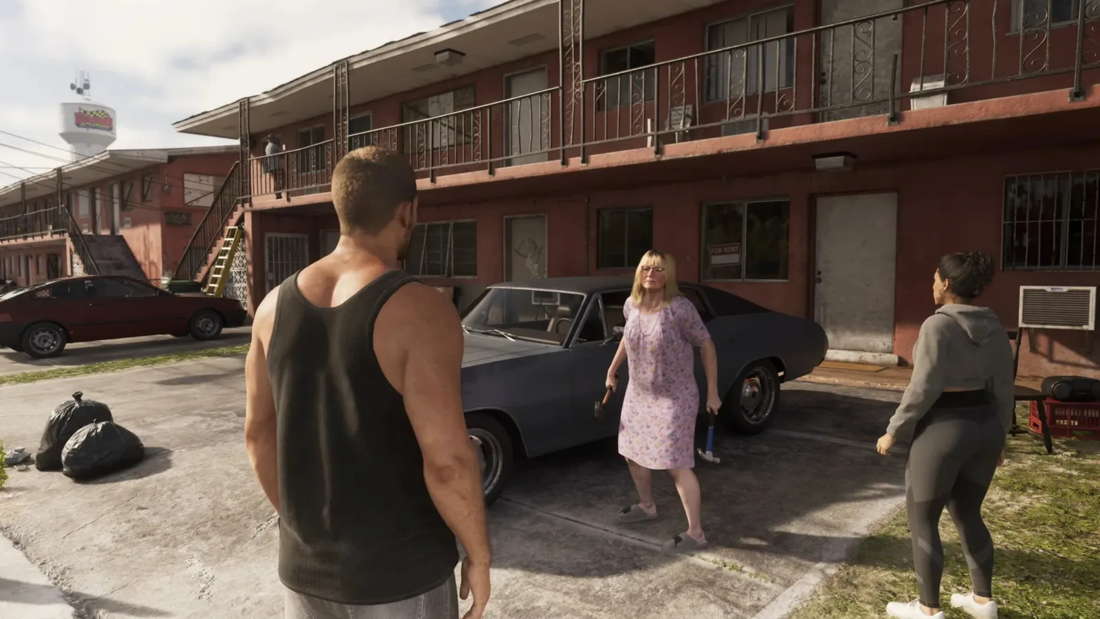 A quiet residential courtyard with residents talking beside parked cars in GTA 6