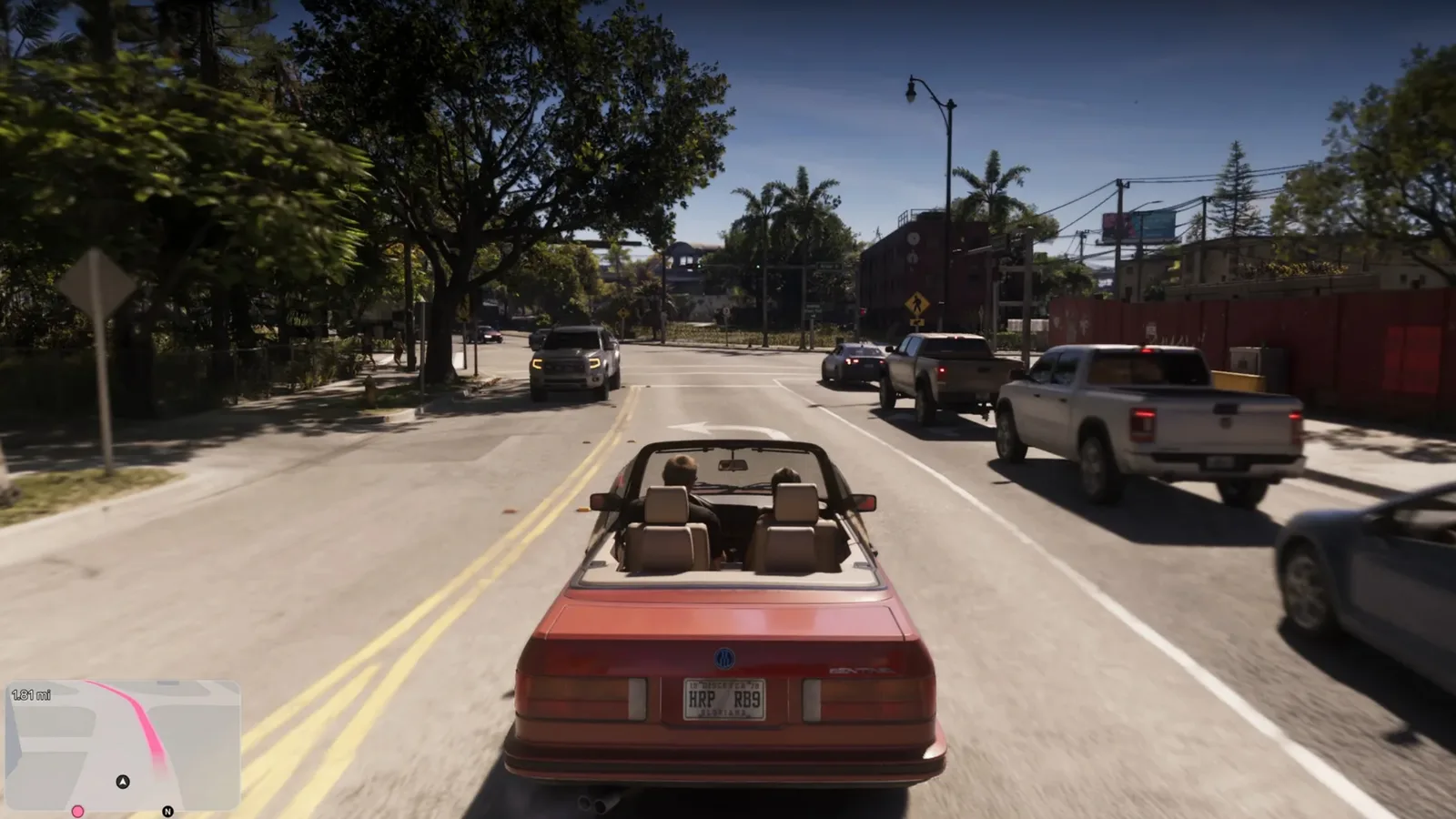 A red convertible driving down a sunlit Vice City street in GTA 6