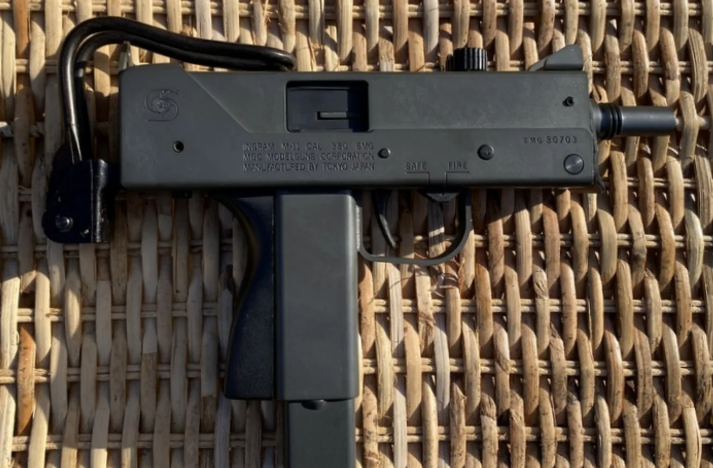 Ingram MAC-11 machine pistol lying flat on a woven surface, the real-world basis for the GTA 6 MAC-11.
