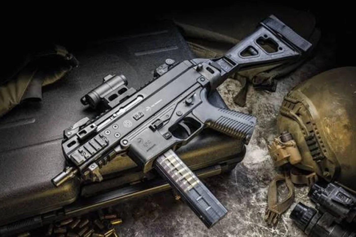 Brügger & Thomet APC9 K PRO compact sub gun with a folding brace resting on military kit, the real-world basis for the S&M DW9.
